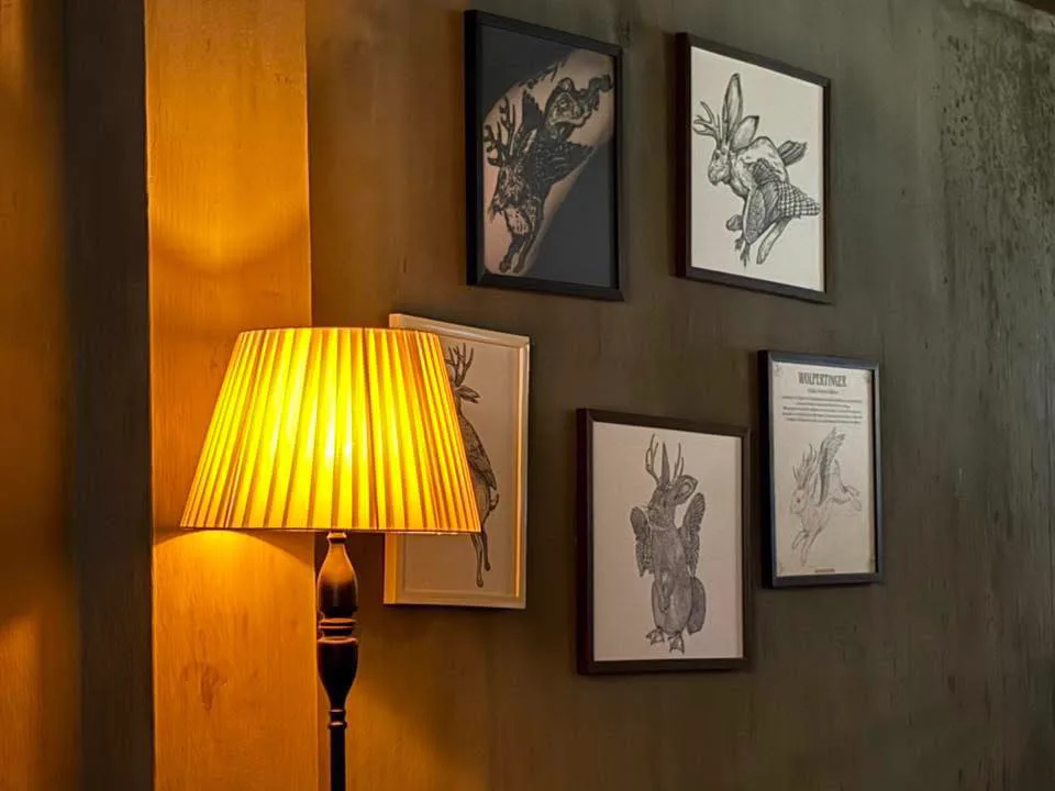 Framed Wolpertinger creature artwork inside the venue